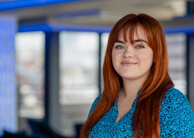 Young woman in office smiling