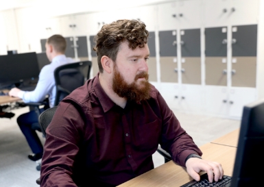 Man in I.T. Department working at a desk