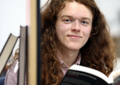 Young man in library