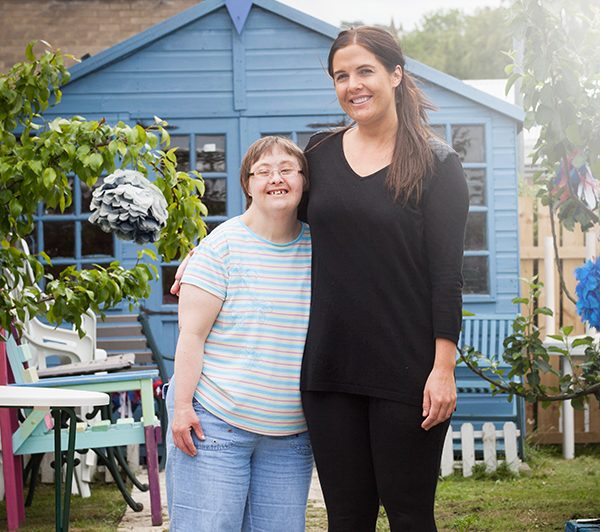 Adult Social Worker with a service user in a garden